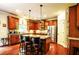 Spacious kitchen features granite countertops, stainless steel appliances, and wood cabinets at 1185 Gallatin Way, Suwanee, GA 30024