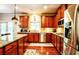 Open concept kitchen with granite countertops, stainless steel appliances, and ample counter space at 1185 Gallatin Way, Suwanee, GA 30024