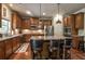Stylish kitchen featuring granite countertops, stainless steel appliances, and wooden cabinets at 1185 Gallatin Way, Suwanee, GA 30024