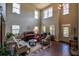 Inviting living room with high ceilings, large windows, and hardwood floors at 1185 Gallatin Way, Suwanee, GA 30024