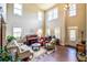 Spacious living room with soaring ceilings, hardwood floors, and stylish decor at 1185 Gallatin Way, Suwanee, GA 30024