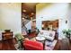 Bright living room features a staircase, fireplace, and colorful accents throughout the space at 1185 Gallatin Way, Suwanee, GA 30024
