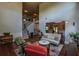 Cozy living room featuring hardwood floors, high ceilings, elegant furniture, and beautiful piano at 1185 Gallatin Way, Suwanee, GA 30024
