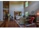 Spacious living room with soaring ceilings, hardwood floors, and a piano at 1185 Gallatin Way, Suwanee, GA 30024