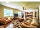 Expansive living room with an open layout that connects to the dining area and kitchen at 1185 Gallatin Way, Suwanee, GA 30024
