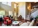 Inviting living room with high ceilings, hardwood floors, and a staircase at 1185 Gallatin Way, Suwanee, GA 30024