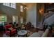 Elegant living room with high ceilings, hardwood floors, and stylish furniture at 1185 Gallatin Way, Suwanee, GA 30024