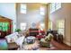 Grand living room with tall ceilings, hardwood floors, and an abundance of natural light at 1185 Gallatin Way, Suwanee, GA 30024