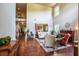 Bright, open living room with hardwood floors, high ceilings, and large windows at 1185 Gallatin Way, Suwanee, GA 30024