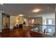 Large upstairs loft area featuring hardwood floors and multiple doors and entryways at 1185 Gallatin Way, Suwanee, GA 30024