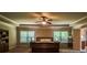 Serene main bedroom with tray ceiling, large windows, ceiling fan and a king bed at 1185 Gallatin Way, Suwanee, GA 30024
