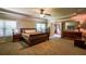 Spacious main bedroom with sitting area, large windows, king bed and a private ensuite at 1185 Gallatin Way, Suwanee, GA 30024