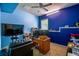 Bright home office featuring an expansive desk, large monitor, and a comfortable leather chair at 1185 Gallatin Way, Suwanee, GA 30024