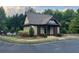 Charming pool house surrounded by well-manicured landscaping and lush greenery at 1185 Gallatin Way, Suwanee, GA 30024