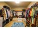 Spacious walk-in closet with ample storage and custom organization systems at 1185 Gallatin Way, Suwanee, GA 30024