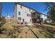 Expansive backyard featuring a patio and a screened-in porch offers ample outdoor living space at 211 Aspen Valley Ln, Dallas, GA 30157
