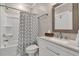 Full bathroom featuring white cabinets, shower with tub, and modern fixtures at 211 Aspen Valley Ln, Dallas, GA 30157