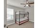 Bedroom with a bunk bed, neutral walls and window at 211 Aspen Valley Ln, Dallas, GA 30157