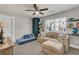 Comfortable playroom featuring a sofa and shelves with decorations at 211 Aspen Valley Ln, Dallas, GA 30157