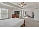 This oversized primary bedroom has a connected workspace and large windows for natural light at 211 Aspen Valley Ln, Dallas, GA 30157
