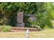 Oakleigh Pointe entrance with stone sign and manicured landscaping welcomes residents and guests at 211 Aspen Valley Ln, Dallas, GA 30157
