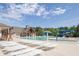 Community pool with a slide, sun loungers, and a shaded pavilion and clubhouse nearby at 211 Aspen Valley Ln, Dallas, GA 30157