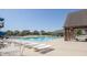 Community pool with a slide, sun loungers, and a shaded pavilion for relaxing at 211 Aspen Valley Ln, Dallas, GA 30157