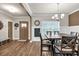 Dining room with rustic table, chair set, wall decor and window at 211 Aspen Valley Ln, Dallas, GA 30157