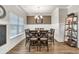Formal dining room with a large window, a stylish chandelier, and seating for eight at 211 Aspen Valley Ln, Dallas, GA 30157