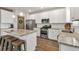 Modern kitchen featuring stainless steel appliances, granite countertops, and an island at 211 Aspen Valley Ln, Dallas, GA 30157
