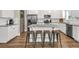 Modern kitchen with stainless steel appliances, granite countertops, and center island at 211 Aspen Valley Ln, Dallas, GA 30157
