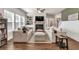 Inviting living room features hardwood floors, a cozy fireplace, and built-in shelving at 211 Aspen Valley Ln, Dallas, GA 30157