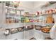 Organized pantry with wire shelving and a variety of food items at 211 Aspen Valley Ln, Dallas, GA 30157