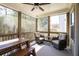 Screened-in porch with comfortable seating and views of surrounding trees at 211 Aspen Valley Ln, Dallas, GA 30157