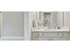Well-lit bathroom with a white vanity and ample counter space at 4383 Capstone Ne Ct, Roswell, GA 30075