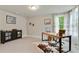 Inviting home office with ample natural light and modern furnishings at 4383 Capstone Ne Ct, Roswell, GA 30075