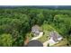 Expansive property featuring a lovely home surrounded by lush greenery and mature trees at 4383 Capstone Ne Ct, Roswell, GA 30075