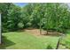 Expansive backyard with lush greenery and a wooded perimeter offers privacy at 4383 Capstone Ne Ct, Roswell, GA 30075