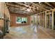 Unfinished basement space ready for customization; features window and exposed beams at 4383 Capstone Ne Ct, Roswell, GA 30075