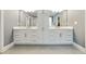 Elegant bathroom with double vanity, lots of drawers for storage, and a large mirror at 4383 Capstone Ne Ct, Roswell, GA 30075