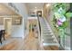 Grand foyer with staircase, high ceilings, and hardwood floors at 4383 Capstone Ne Ct, Roswell, GA 30075