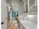 Modern kitchen featuring white countertops and cabinets, stainless steel appliances, and eat-in dining area at 4383 Capstone Ne Ct, Roswell, GA 30075