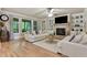 Inviting living area features a fireplace, built-in shelves, and hardwood floors at 4383 Capstone Ne Ct, Roswell, GA 30075