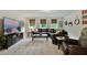 Living room with comfortable leather furniture, large TV, and natural light from the windows at 4383 Capstone Ne Ct, Roswell, GA 30075