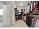 Well-organized walk-in closet with shelving and rods for ample storage at 4383 Capstone Ne Ct, Roswell, GA 30075