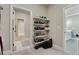 Well-organized walk-in closet with shelves for shoes and clothing at 4383 Capstone Ne Ct, Roswell, GA 30075