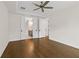 Bright bedroom featuring hardwood floors, a ceiling fan and white trim at 527 Pearl St, Cumming, GA 30040