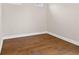 Bedroom featuring hardwood floors, white baseboards and neutral walls at 527 Pearl St, Cumming, GA 30040