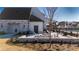 Outdoor patio area featuring seating, a fire pit, and views of the surrounding community at 527 Pearl St, Cumming, GA 30040