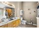 Bathroom featuring double sinks, warm lighting, and a neutral color palette at 995 Chimney Trace Way, Lawrenceville, GA 30045